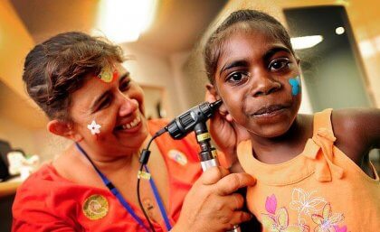 Child having ear examined by doctor