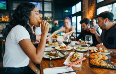 Woman eating at restaurant