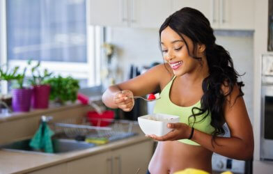Woman eating healthy food, fruit, salad
